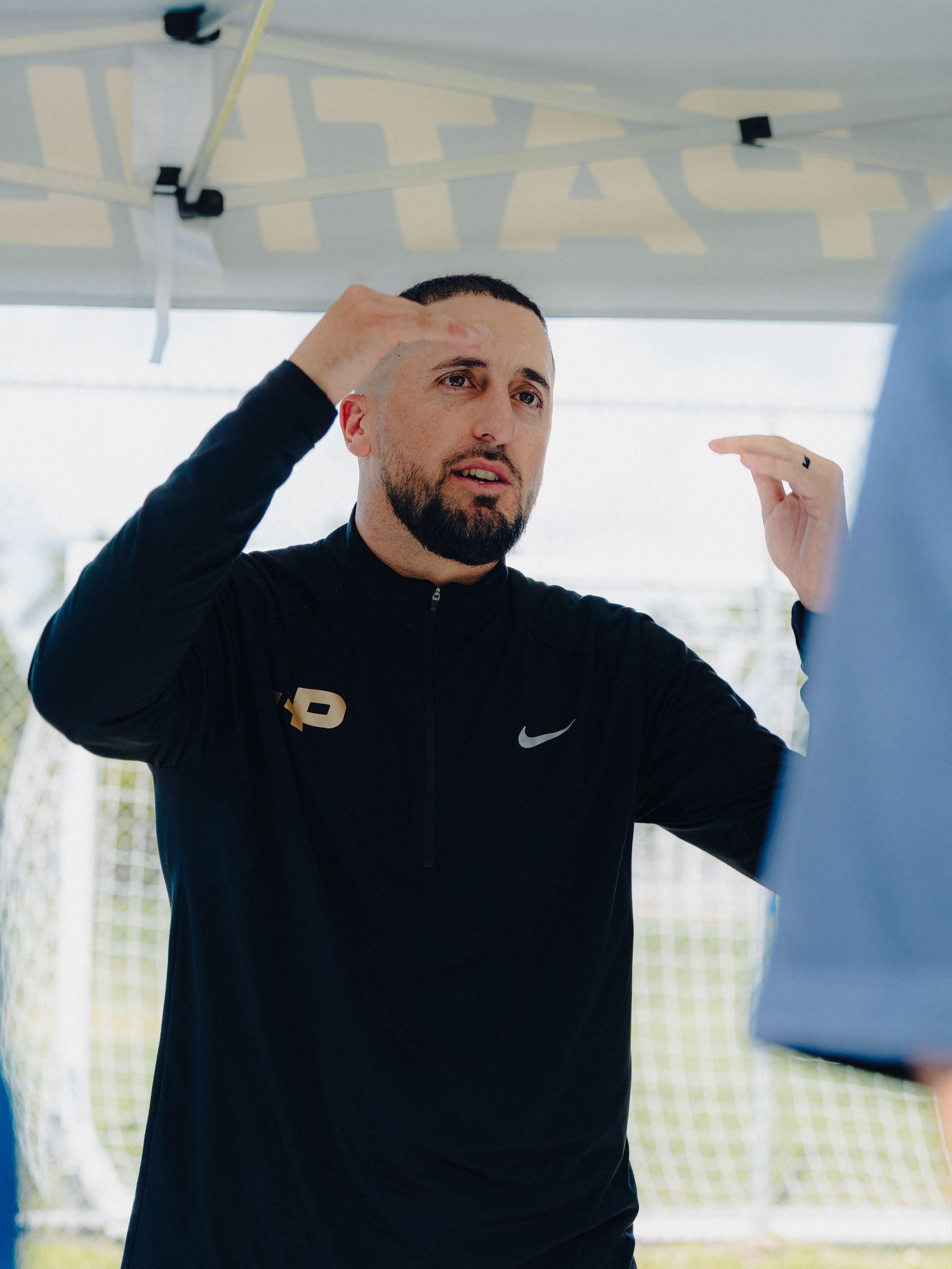 Coach instructing at a Pathlete Combine